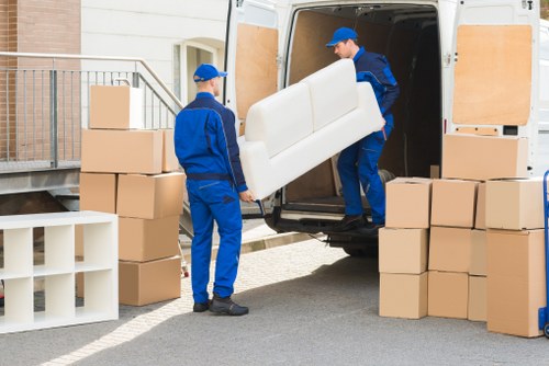 Local Collierswood moving service loading furniture into a van